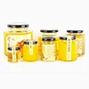 /product-detail/cheap-food-grade-hexagon-glass-honey-jar-with-label-sticker-60736235599.html