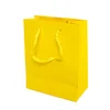 Art paper A4 custom famous brand yellow shopping paper gift bag with logo printing