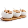 Embossed pattern round shape custom kitchen white unique ceramic canister set with wooden lid