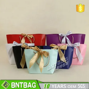 colorful paper gift tote bag with bow tie ribbon tie