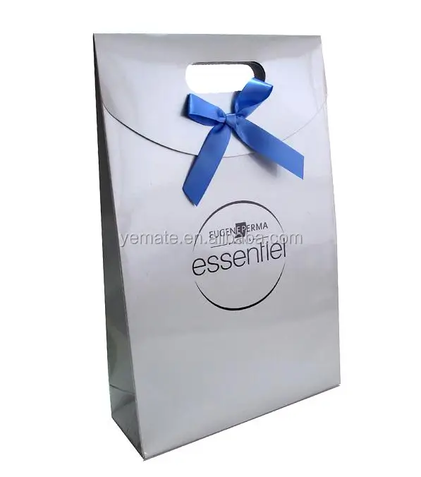 silver color die cut handle paper gift bag with blue bow for