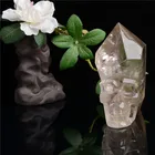 hand carved natural smoky and clear quartz point crystal skull decor for healing