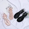 /product-detail/sd-059-2019-fashion-rivet-fli-p-flop-soft-pvc-plain-flat-jelly-sandals-for-women-beach-ladies-antiskid-water-poof-sandals-62207465018.html