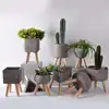 Hot sale triangle indoor cement flowerpot/decorative flower pots with indoor artificial plant