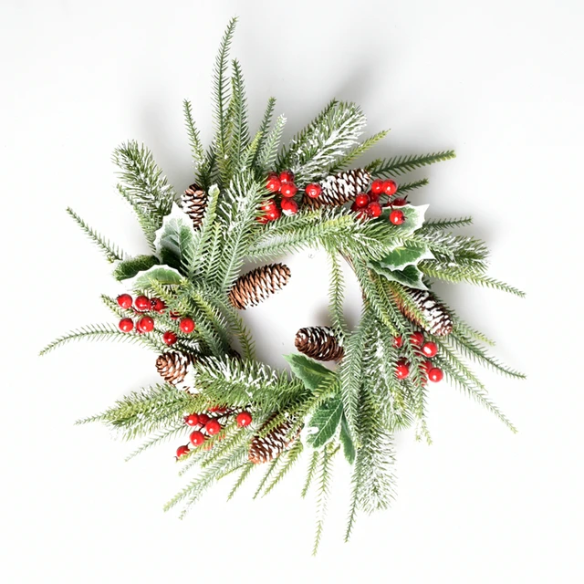 wreath green leaves cranberry and snowy pinecone - christmas