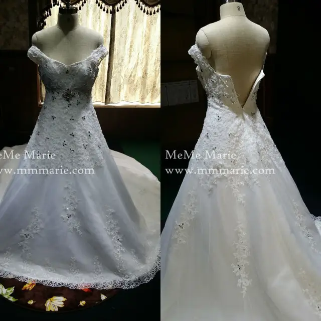 elegant off shoulder wedding dress with crystal band