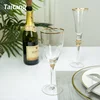 Wedding party drink champagne gold rim white wine glass