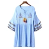 The short blue loose machine embroidery dress with layered sleeve detail