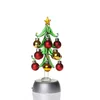 Colored ball hanging on the LED glass christmas tree