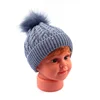 Solid Color Cute Cable Design Baby Beanie Hat With Faux Fur Pom Pom