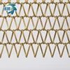 Golden spiral metal decorative mesh used as a short curtain for living room isolation