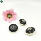 plastic button of gold black ground with snowflake for garment