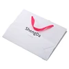 custom logo luxury white cardboard paper bag with pink ribbon handle