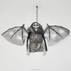 Half plastic skeleton with bat wings
