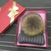 /product-detail/winter-love-gift-acrylic-custom-high-quality-knitted-racoon-fur-pom-pom-beanie-hats-60717699394.html