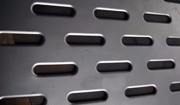 Metal strip with holes