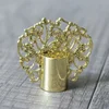 Crown shaped golden perfume bottle cap