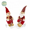 Christmas santa claus doll by bicycle
