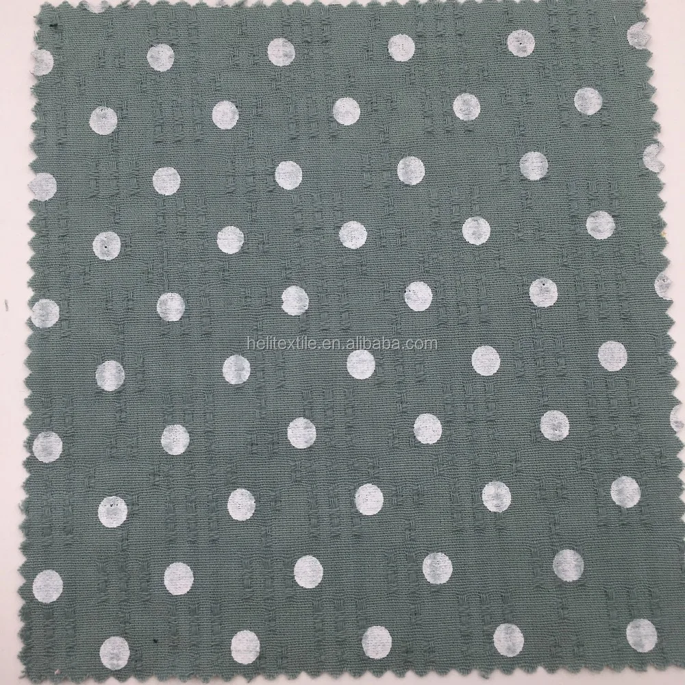 pastel mint green cotton fabric with white polka dots