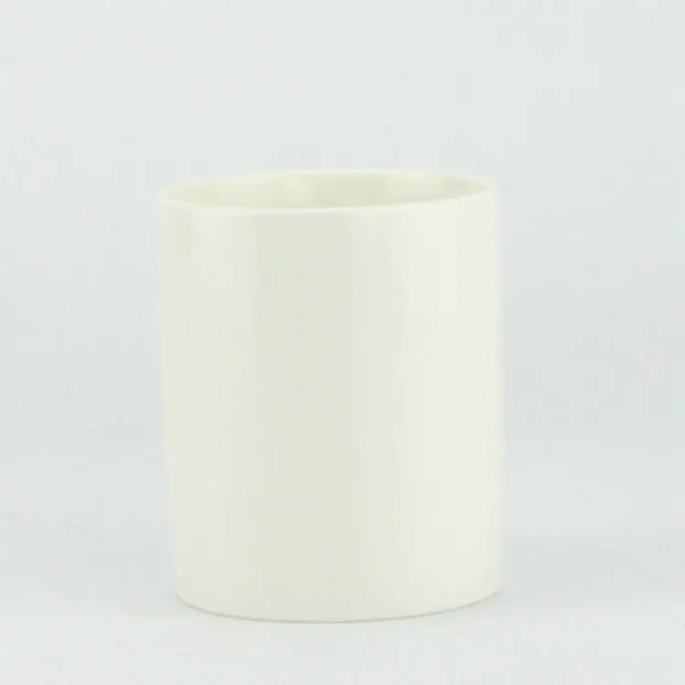 Frosted white unglazed differing sizes ceramic candle jar with lid.JPG