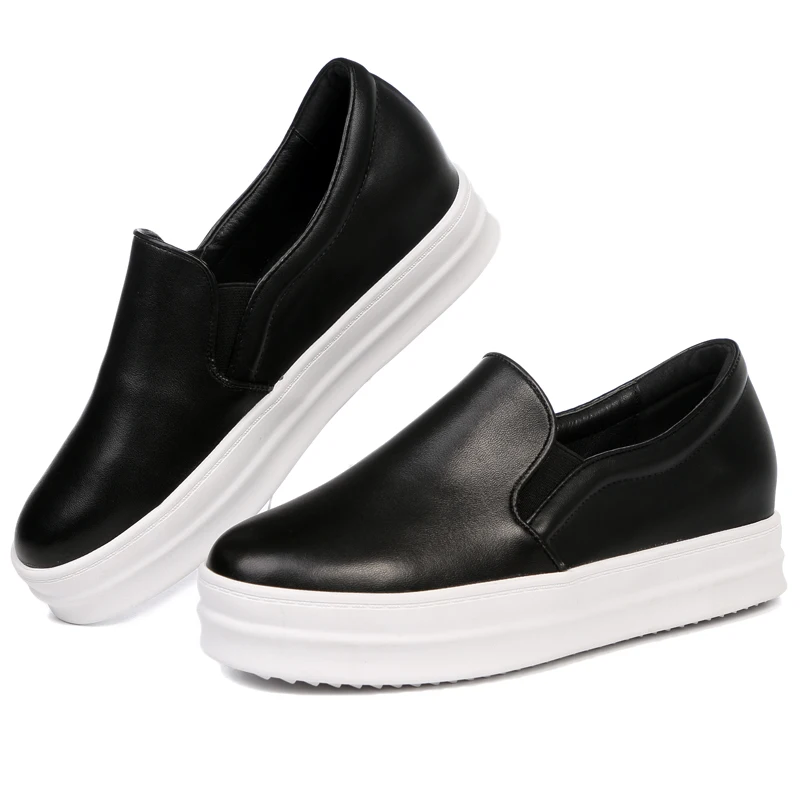 black sneakers with white bottoms