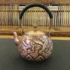 /product-detail/hot-selling-1-3l-hand-carved-animal-shaped-copper-teapot-hand-carved-craft-62222316665.html