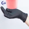 Black disposable latex examination gloves