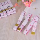 Factory Price Customized Packaging Tailor Tape Measure in White Background Red Scale