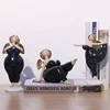 /product-detail/new-design-home-table-decor-cute-black-resin-fat-girl-customized-praying-polyresin-figurine--62332444846.html