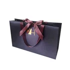 Customized bowknot silk handle white cardboard fancy paper bag