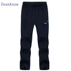2019 new men's casual pants custom Logo mens black jogging bottoms loose track pants joggers with zip pockets