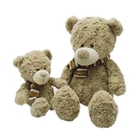 plush stuffed teddy bear toy with knitted scarf