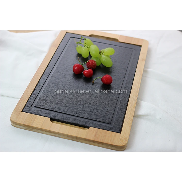 high-class restaurant slate food tray with wooden botton table