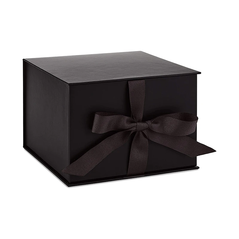 black gift box with lid and shredded paper fill for christmas