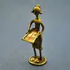 /product-detail/tribal-lady-working-dhokra-artifacts-bronze-bell-metal-sculpture-from-india-170554794.html