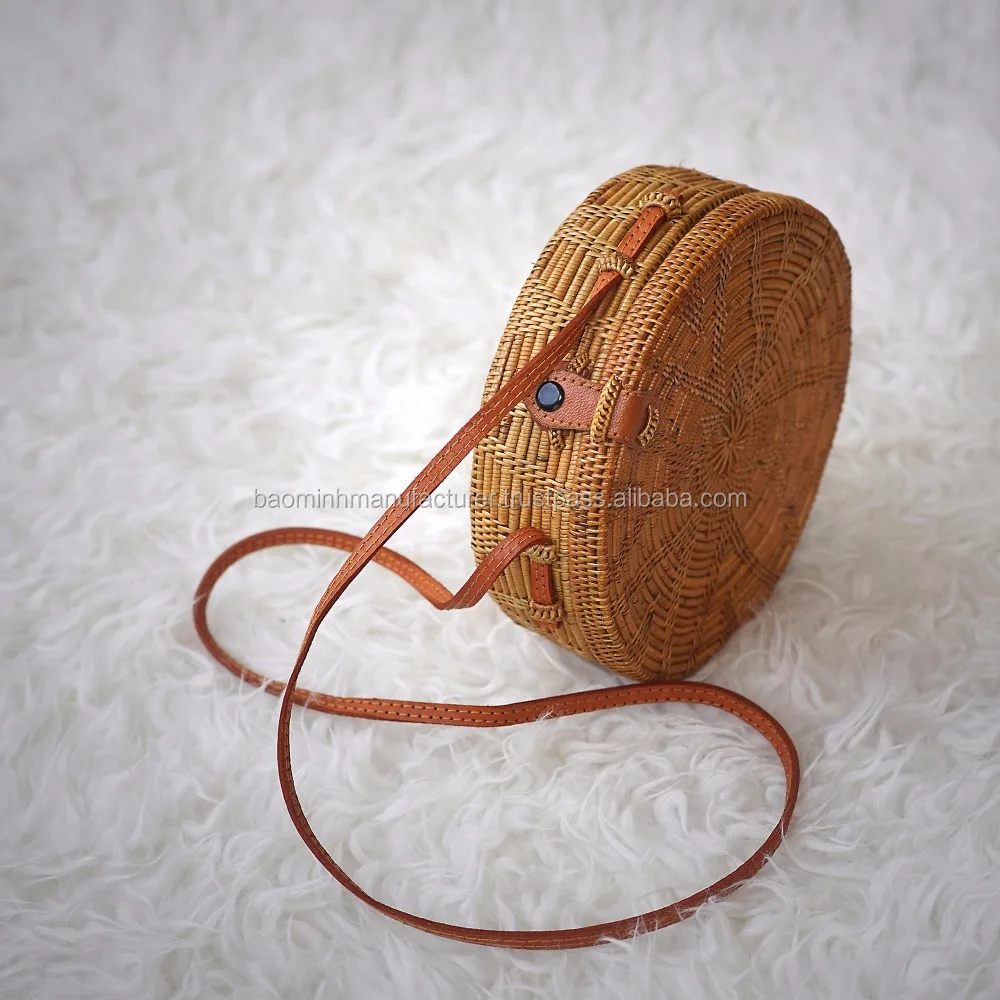 vintage round woven rattan basket bag with leather sling strap