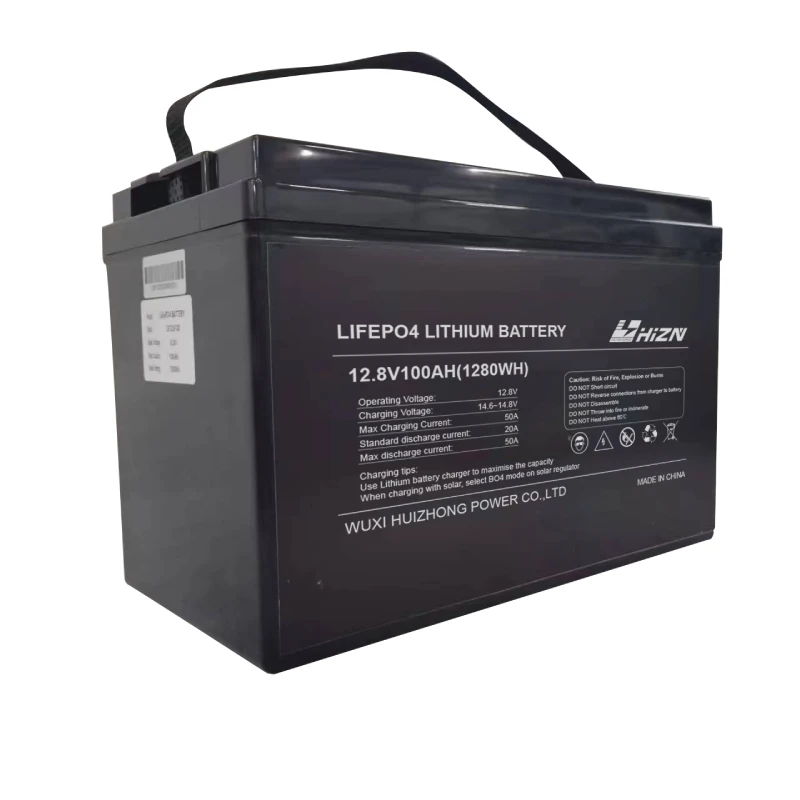 Side-by-side comparison of compact LiFePO4 12V battery and bulky AGM battery mounted in RV battery bay