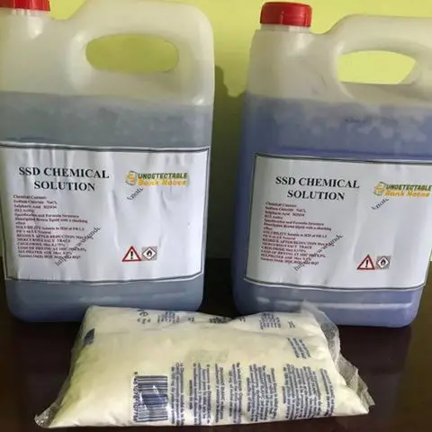 Industrial-grade chemical bottles labeled SSD Solution Chemical, with hazard symbols and purity specifications