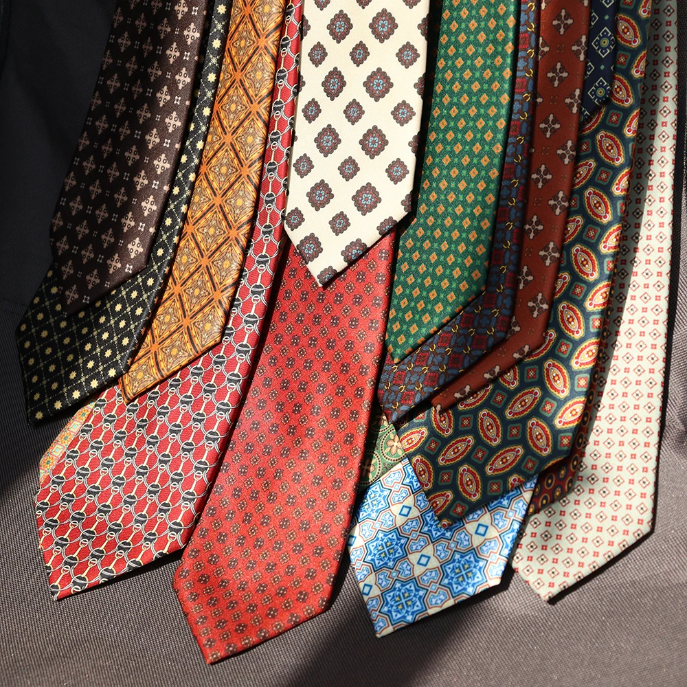 Hand-sewn tie with visible interlining edge and clean roll