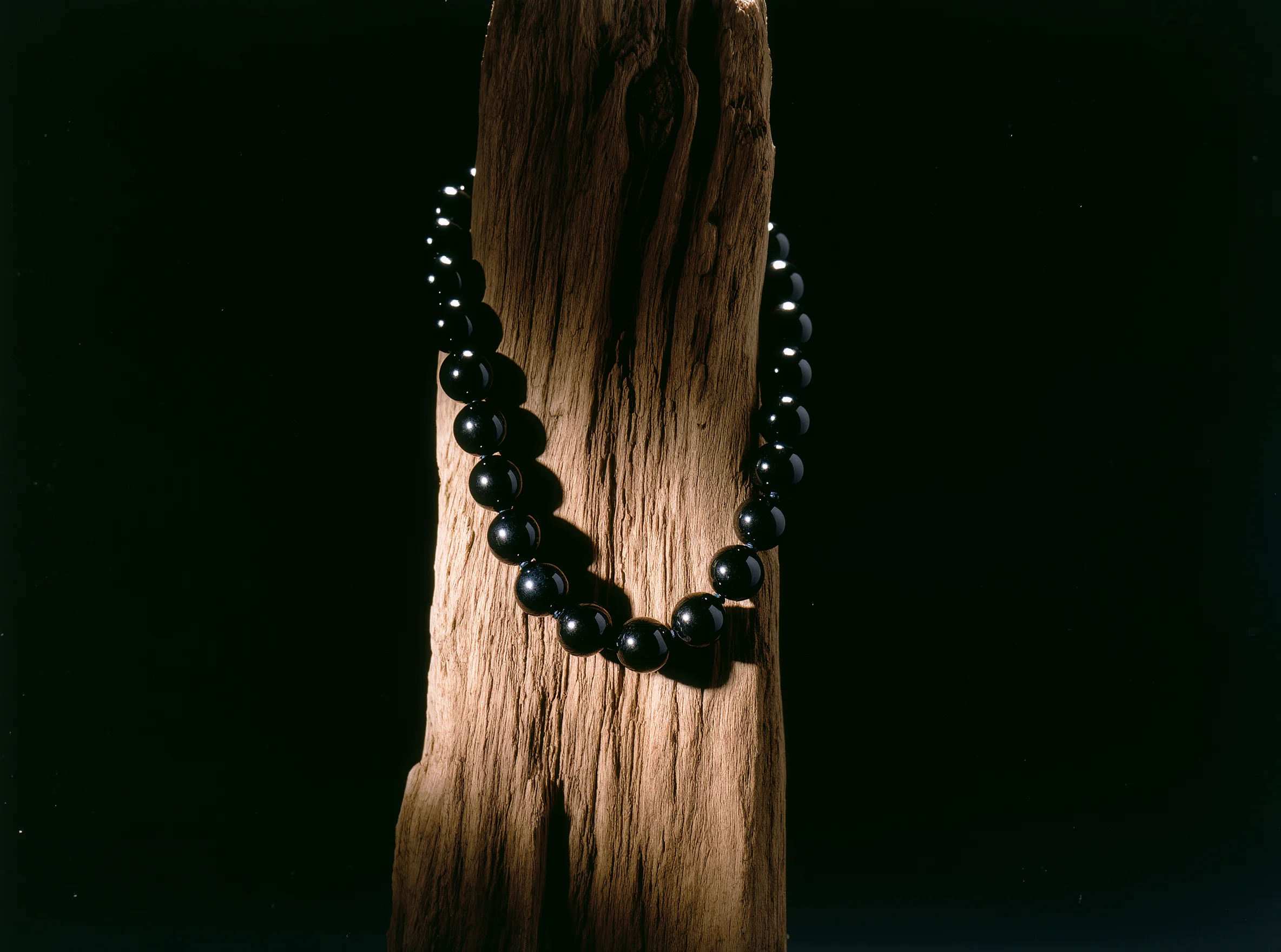FAQ 1 Sovereign Stillness Jewelry FAQ: A handcrafted obsidian relic representing the absolute center and terrestrial integrity of our studio.