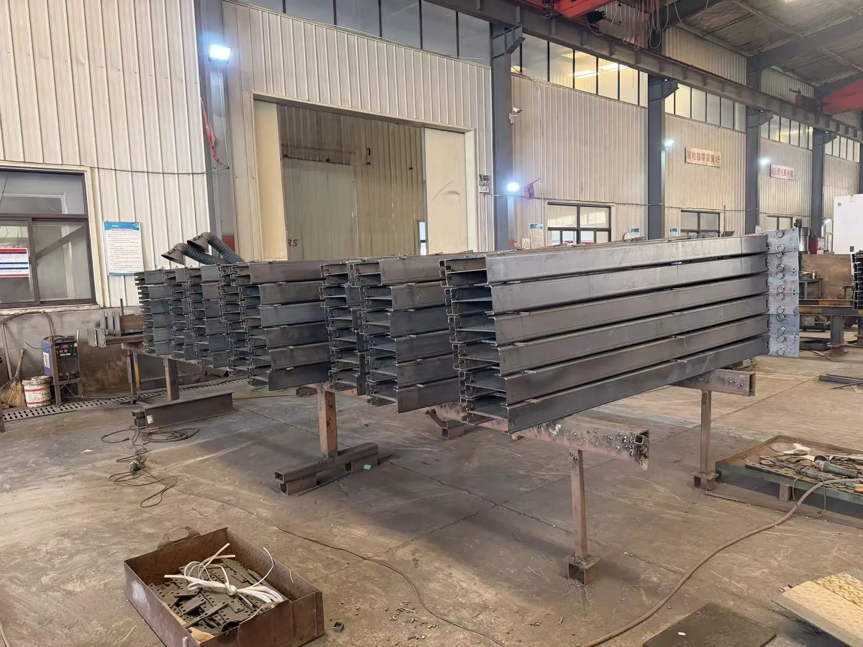 Heavy duty steel components for car parking lifts at ShinInnovation factory