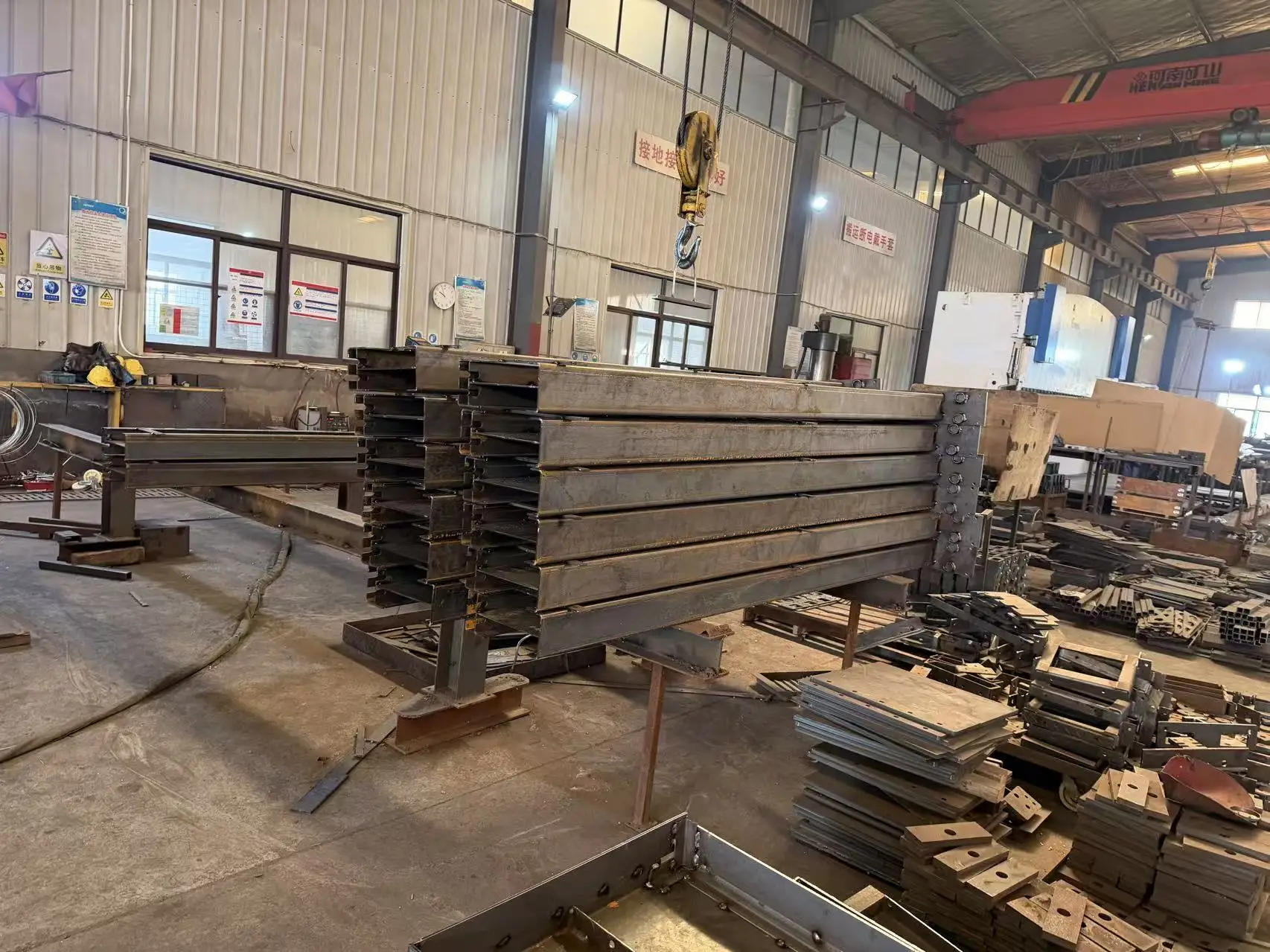 ShinInnovation production line showing precision steel fabrication for parking systems