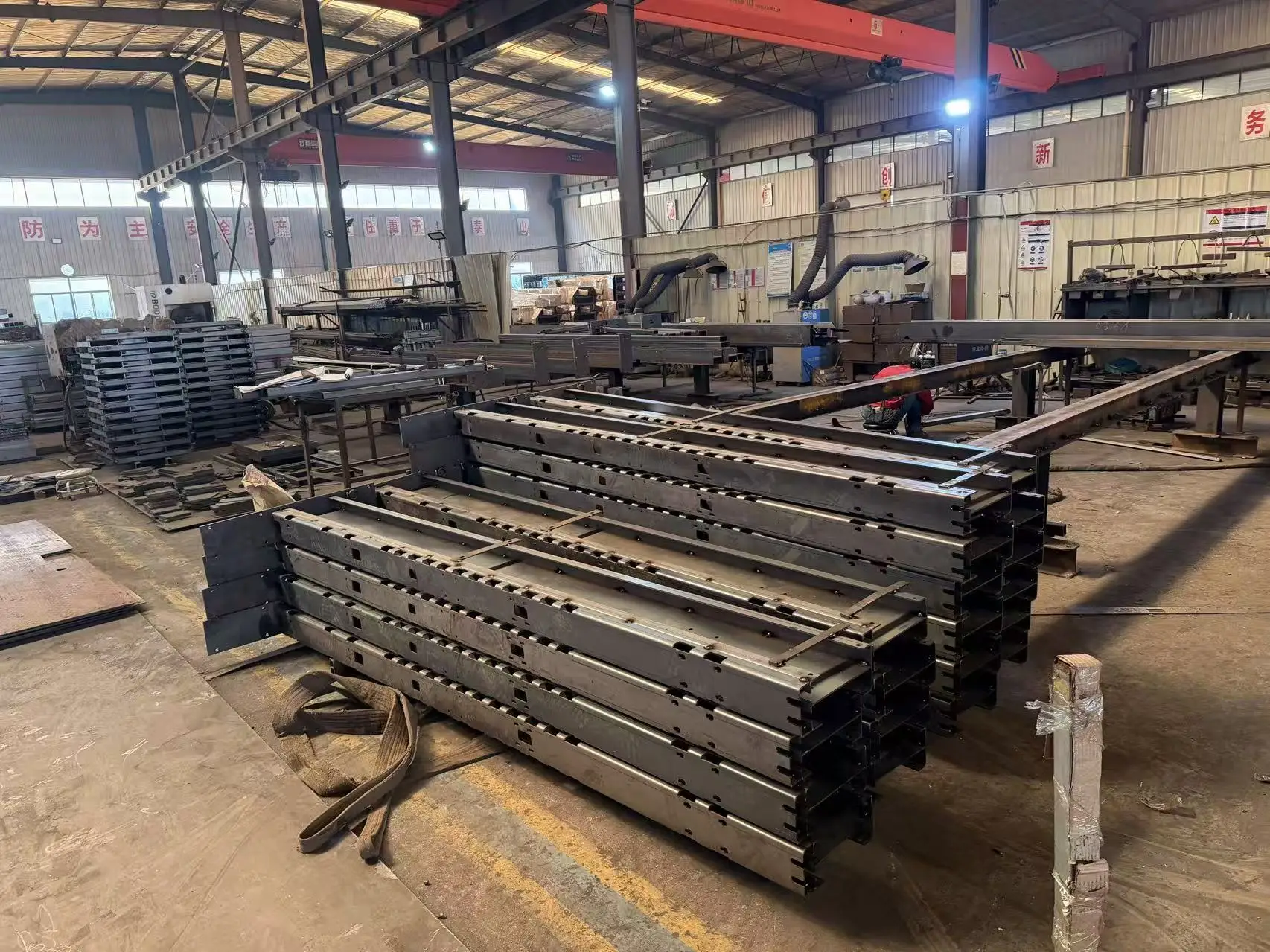 Mass production of car stacker components at our Qingdao facility