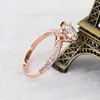 Knife edged 2carat center round moissanite diamond 18k rose gold ring with two rows of accents moissanite stones