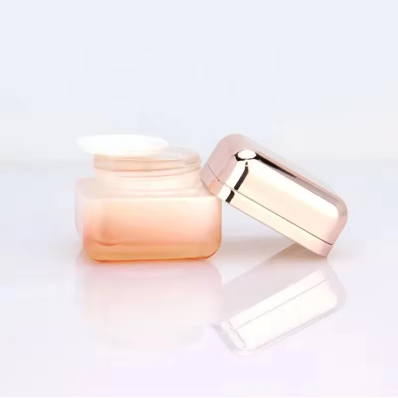 Supplier Cosmetic square glass bottle set Innovative design of rose gold cover for skincare packaging 50g40ml100ml120ml factory