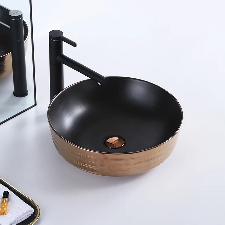 Modern novel design round small plating rose gold black color luxury countertop ceramic sink art washbasin hand wash basin factory