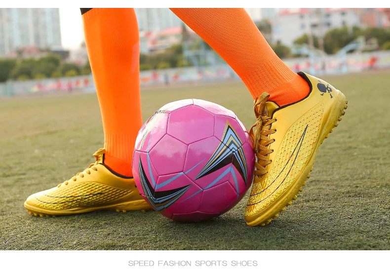 soccer shoes and ball