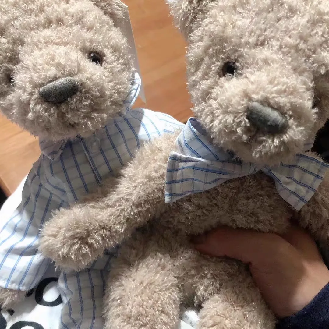 teddy bear with plaid shirt