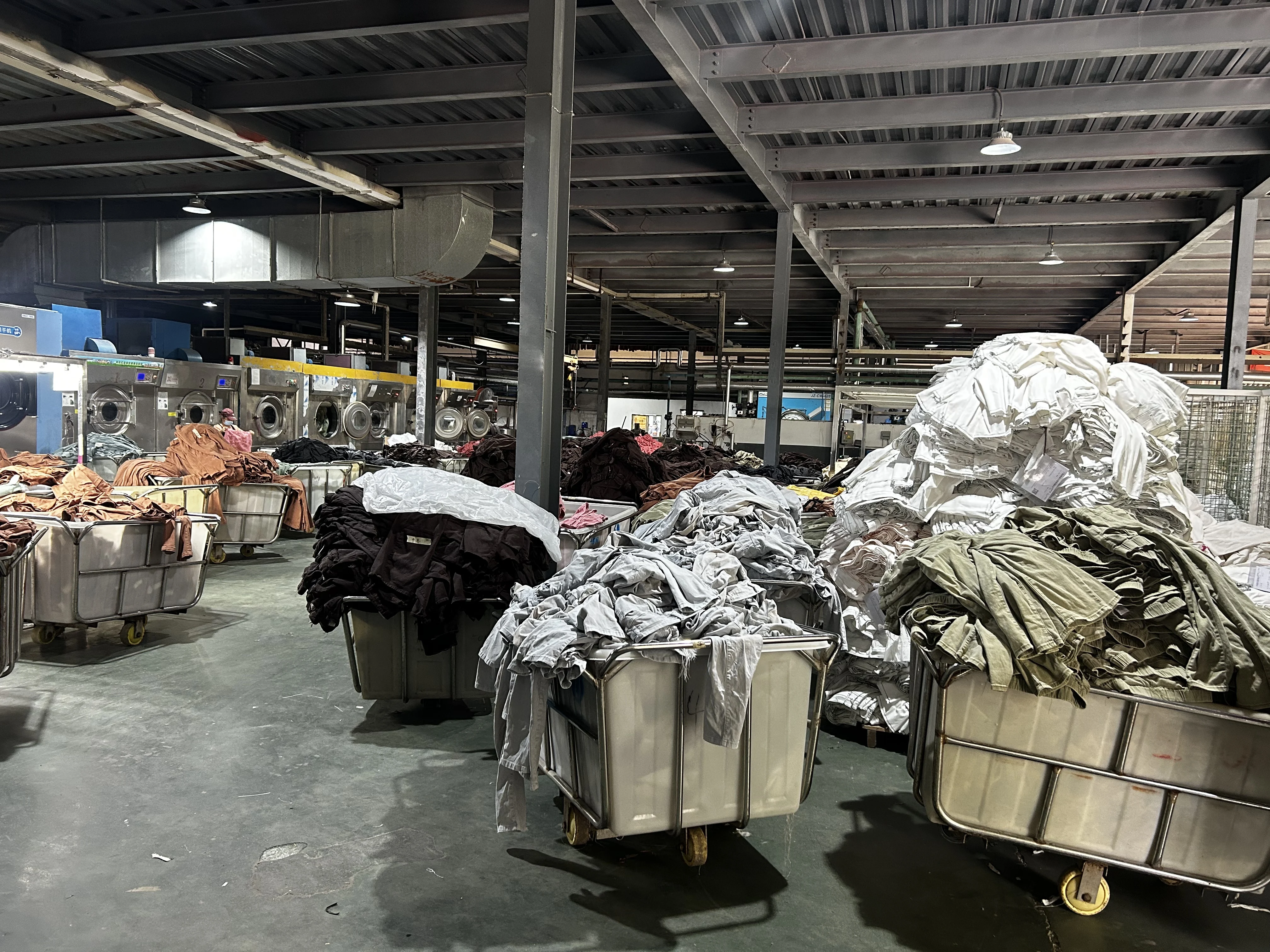 The scale of our Xintang industrial washing lab, capable of processing diverse textures and tones.