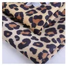 China supplies wholesale faux leopard print suede fabric for women clothing